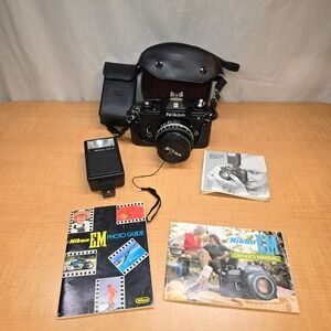 Nikon EM 35mm Camera body, lens, flash, cases, manuals, timer feature.